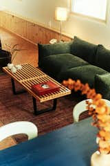 Living Room, Coffee Tables, Lamps, Sofa, and Cork Floor In the living area, a green sofa from Amazon, purchased for around $300, has become a surprise favorite among visitors.